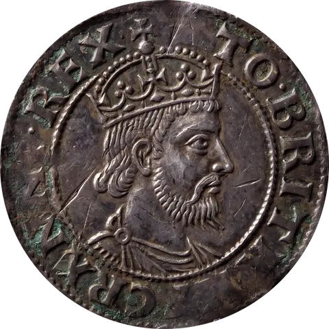 The obverse of a worn silver coin: a crowned, bearded king in profile facing right inside a beaded circle, with raised lettering around the rim that includes REX TO BRIT.